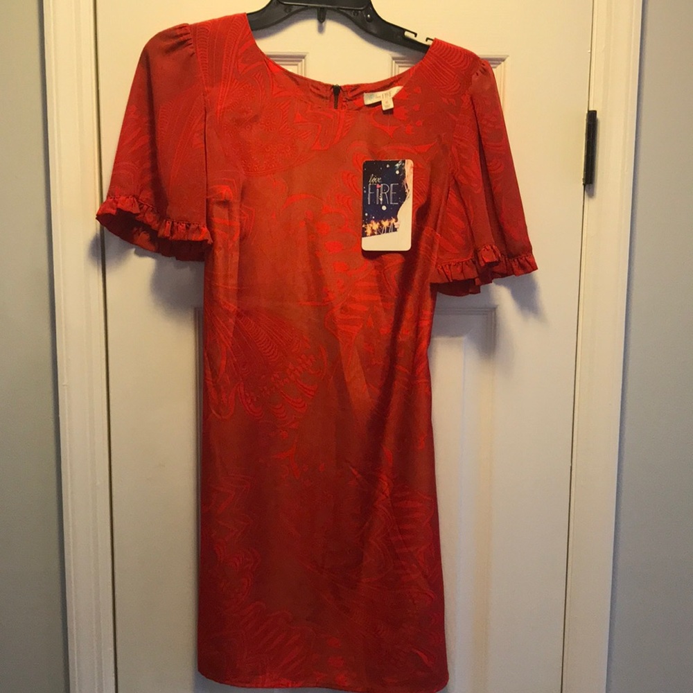 New with tags Orange ruffle sleeve dress!